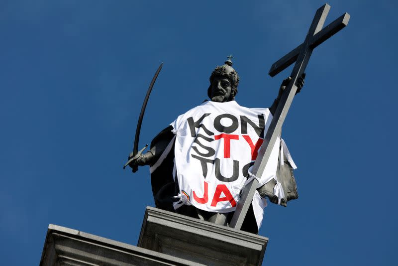 FILE PHOTO: Statue of the King Sigismund at the Old Town, is seen dressed up in a T-shirt with the slogan 'Constitution' in Warsaw