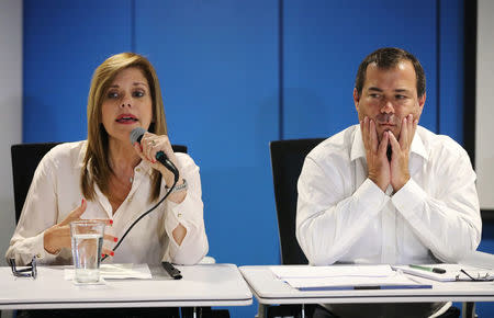 Peru's Prime Minister Mercedes Araoz and Peru's Minister of Transport and Communications Bruno Giuffra attend a news conference in Lima, Peru, March 20, 2018. REUTERS/Guadalupe Pardo