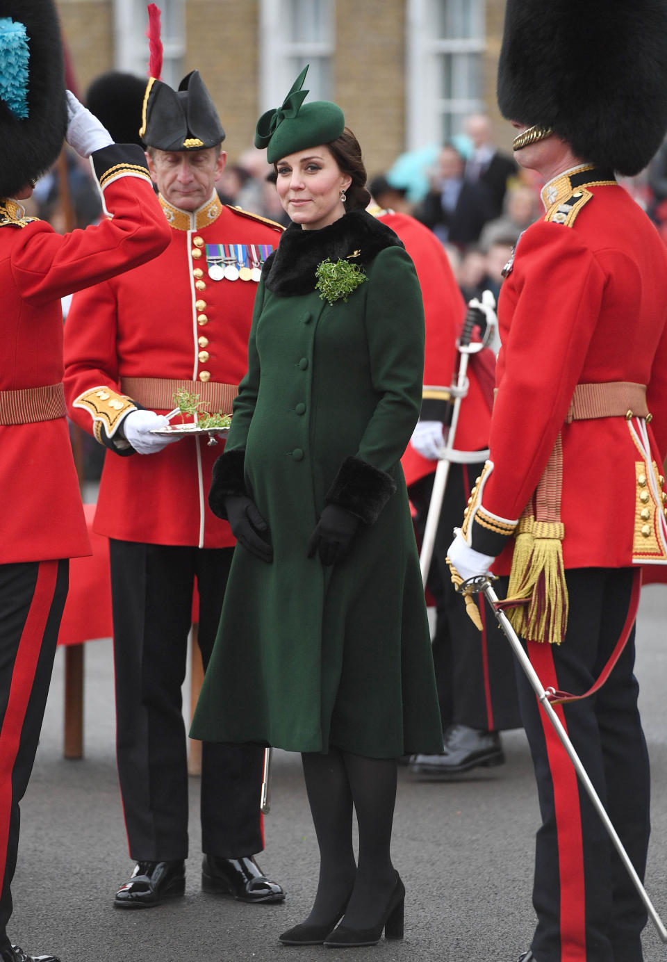 <p>Kate, who was eight months pregnant with Prince Louis, rewore her green Catherine Walker coat from her Norway and Sweden tour, with a matching Gina Foster bow trim hat. She teamed it with her Tod’s Suede pumps and her special edition Kiki McDonough green tourmaline, green amethyst and diamond earrings. <em>[Photo: PA]</em> </p>