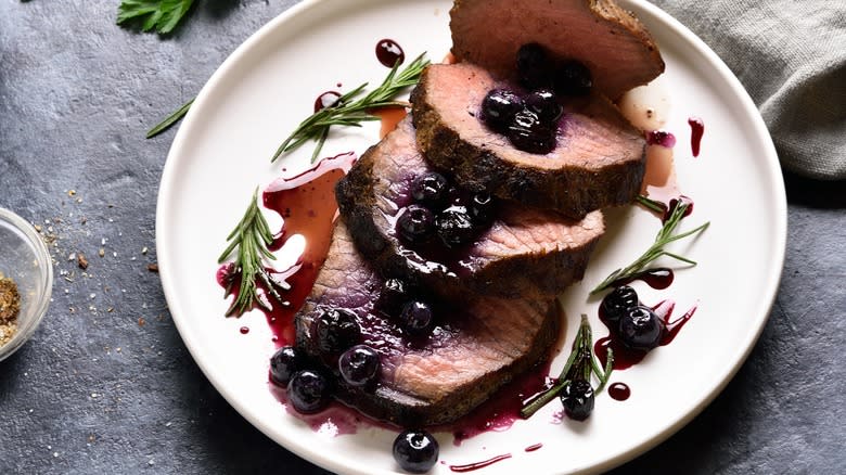 Steak with blueberries