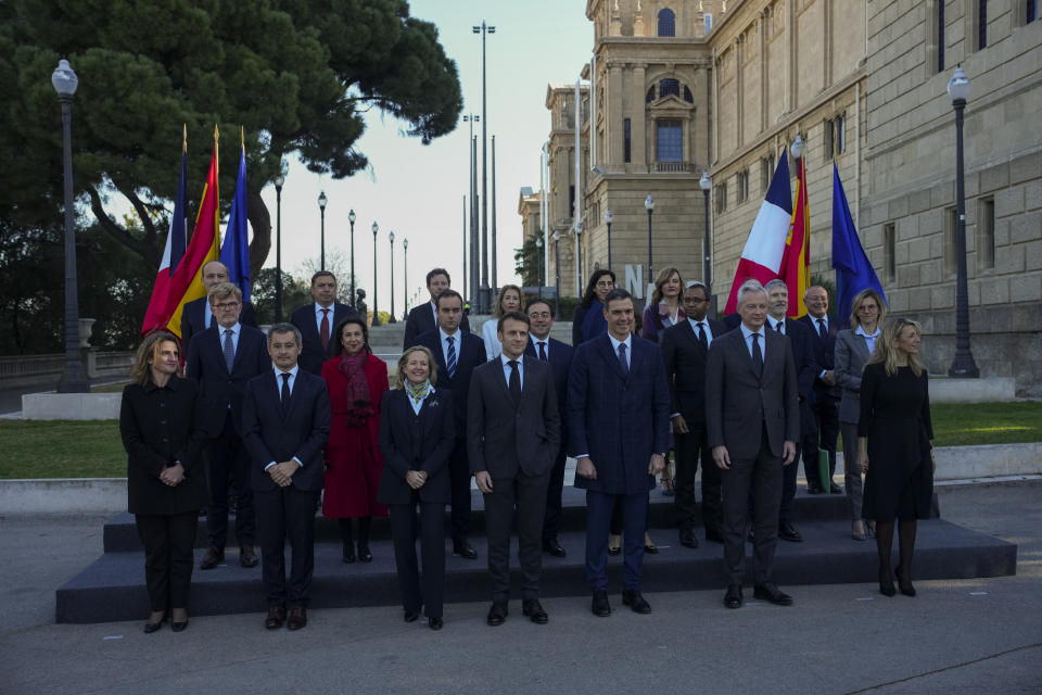 French President Emmanuel Macron and Spanish counterpart Pedro Sánchez, centre, and members of France and Spanish delegations pose for the media in Barcelona, Spain, on Thursday, Jan. 19, 2023. A summit between the Spanish and French governments, led by their executive leaders, prime minister Pedro Sánchez and president Emmanuel Macron, is held in the capital of Catalonia to strengthen relations between the European neighbors by signing a friendship treaty. (AP Photo/Emilio Morenatti)