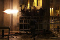 Riot police fire rubber bullets against the anti-government protesters, during ongoing protests against the political elites who have ruled the country for decades, in Beirut, Lebanon, Sunday, Jan. 19, 2020. Lebanese security forces used tear gas, water cannons and rubber bullets in clashes with hundreds of anti-government protesters outside the country's Parliament on Sunday, as violence continued to escalate in a week of rioting in the capital. (AP Photo/Hassan Ammar)