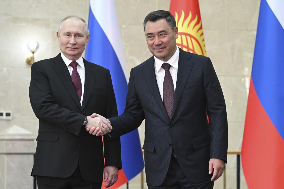 Russian President Vladimir Putin, left, and Kyrgyzstan's President Sadyr Japarov, right, pose for a photo prior to their talks in Bishkek, Kyrgyzstan, Thursday, Oct. 12, 2023. (Dmitry Azarov, Sputnik, Kremlin Pool Photo via AP)