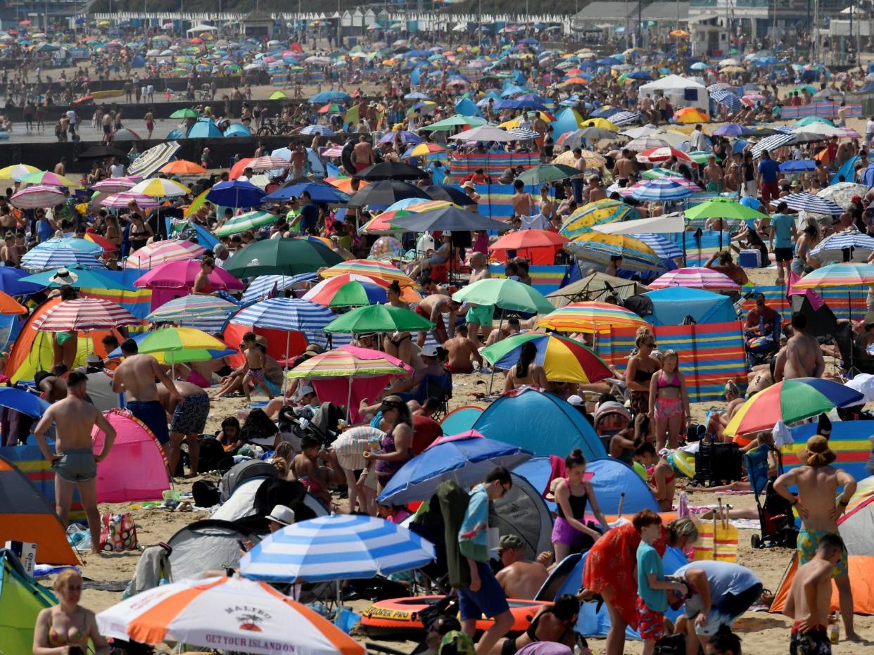 People bask in the sun at Bournemouth beach on 31 July, 2020, the warmest day of the year so far: REUTERS/Toby Melville