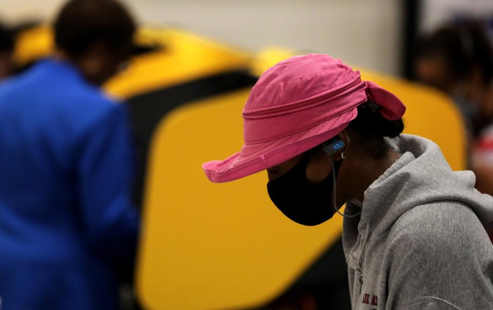 A voter checks in at a polling place