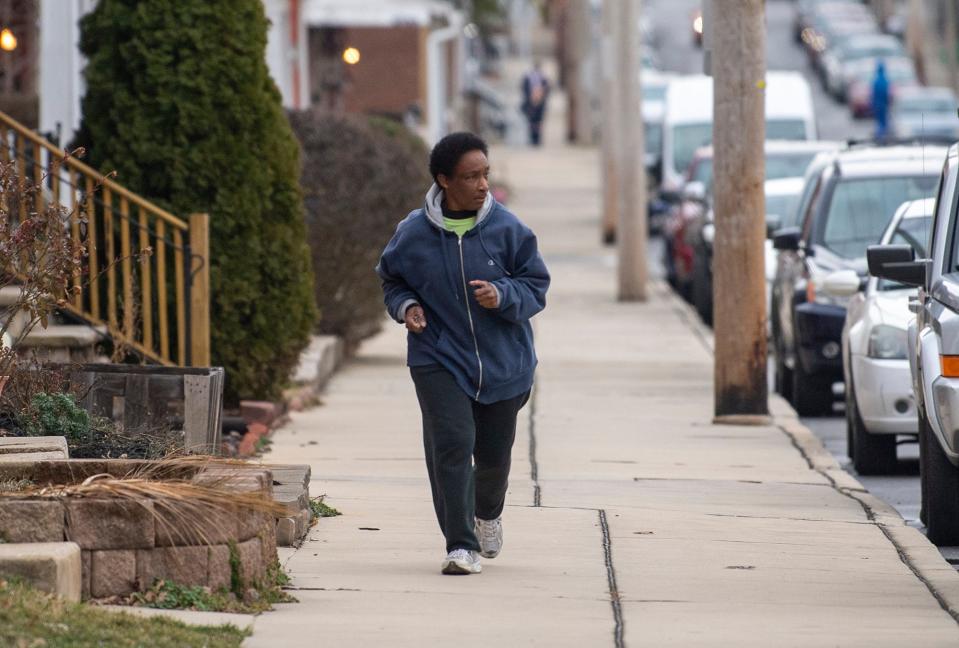 Loretta Claiborne runs through the streets of York, Pa. on February 22, 2023. Claiborne began life in the 1960s, a mentally and physically disabled Black girl growing up in a housing project with seven siblings and a single mother. She blossomed into a long-distance runner and Special Olympics icon for decades.