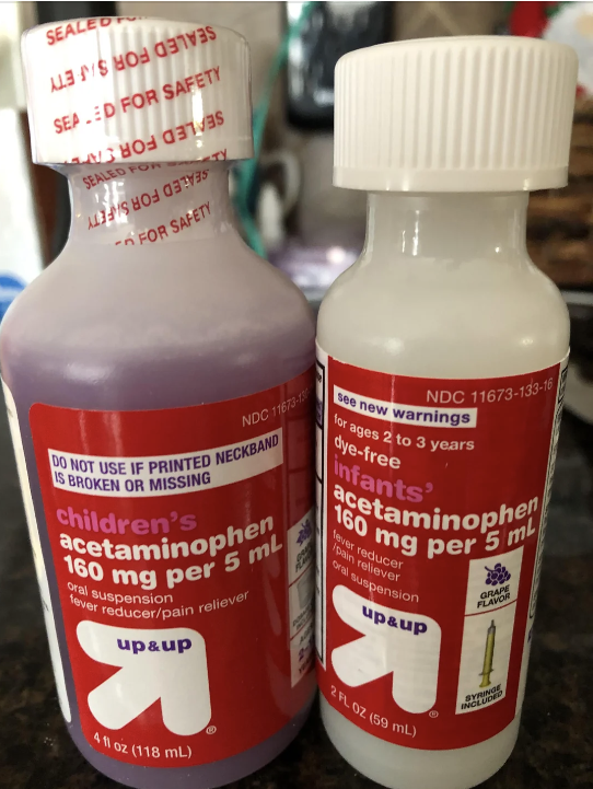 Two bottles of Up & Up brand acetaminophen. Left: Children's acetaminophen, 160 mg per 5 mL. Right: Infants' acetaminophen, 160 mg per 5 mL