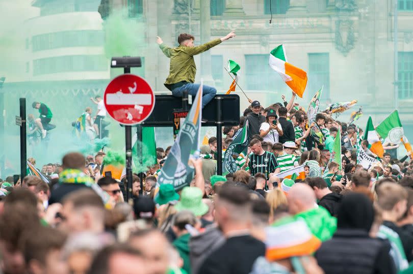 Thousands of Celtic gathered at Glasgow Cross.