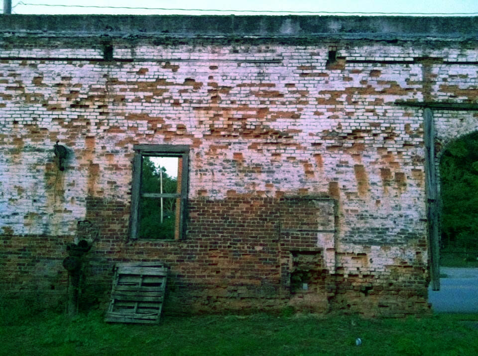 This Oct. 1, 2013 photo shows the brick wall from an old building in Grantville, Ga., that was used to film a scene in the AMC TV drama “The Walking Dead.” Tourists come to the west Georgia town to see the wall and other nearby buildings where scenes from the show were filmed. (AP Photo/Jeff Martin)