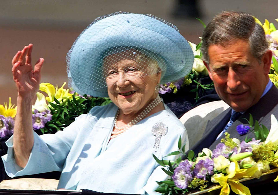 Queen Elizabeth, the Queen Mother, waves from a horse drawn carriage with her grandson Prince Charles as she celebrates her 100th birthday. Thousands of people lined the streets to the gates of Buckingham Palace to cheer the Queen Mother.   (Photo by PA Images via Getty Images)