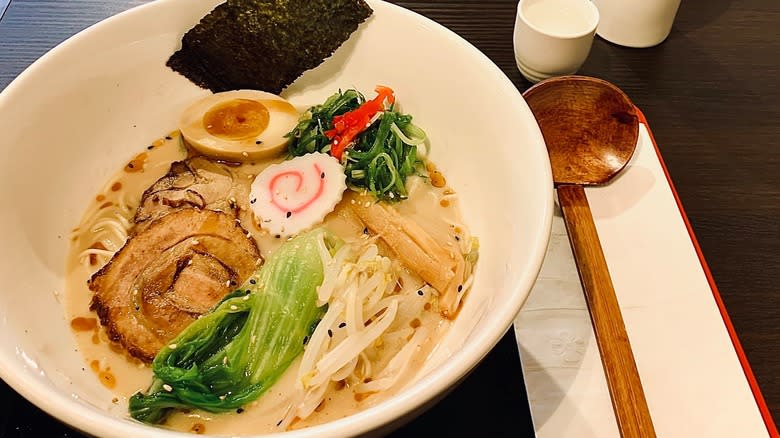 Tonkotsu ramen bowl with utensils