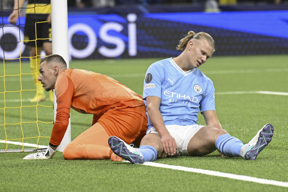 YB's Goalkeeper Anthony Racioppi, left, and Manchester City's Erling Haaland react, during the Champions League group G soccer match between BSC Young Boys and Manchester City, at the Wankdorf stadium, in Bern, Switzerland, Wednesday, Oct. 25, 2023. (Anthony Anex/Keystone via AP)