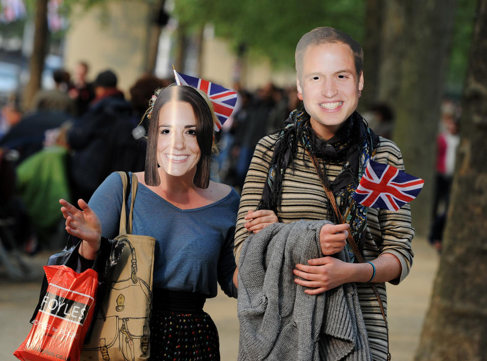 LONDON, ENGLAND - APRIL 28: A couple strolls the Mall while wearing Prince William and Catherine Middleton masks ahead of tomorrow's marriage ceremony of Prince William and Catherine Middleton in Westminster Abbey on April 28, 2011 in London, England. With less than 24 hours to go final preparations for the wedding of Prince William and Catherine Middleton are in place. (Photo by Jasper Juinen/Getty Images)