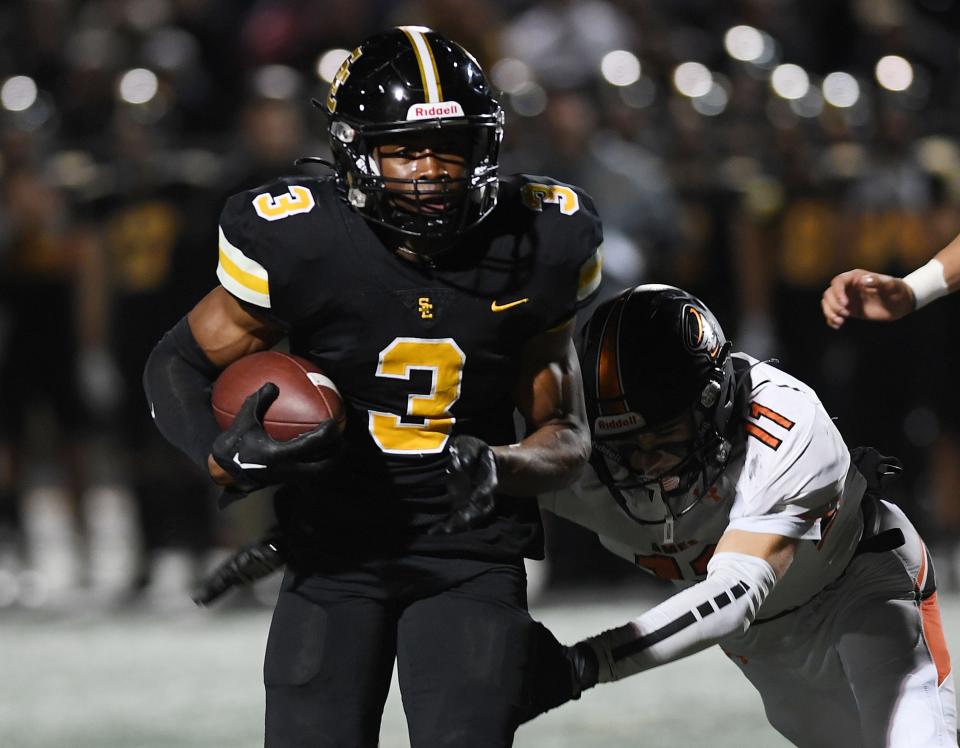 Southeast Polk running back Abu Sama (3) runs for a touchdown around Ames' defensive back Cameron Cantonwine (11) during the first quarter.