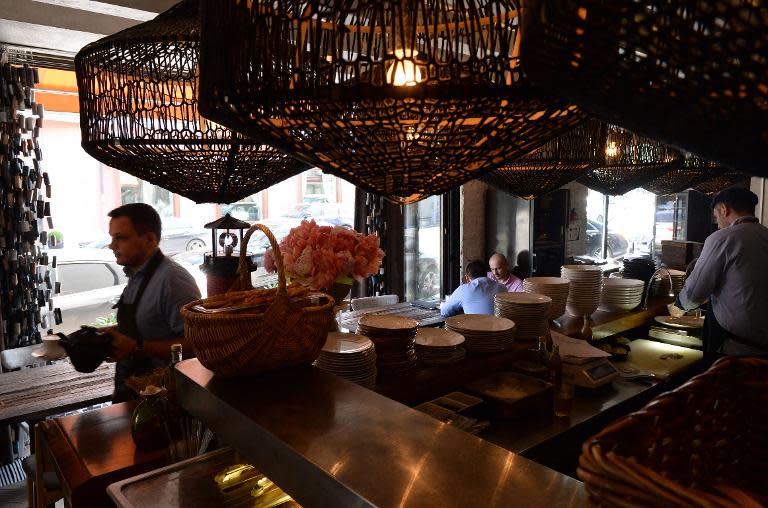 Employees work in the Poyekhali (Let's Go) restaurant in Moscow, on June 2, 2015