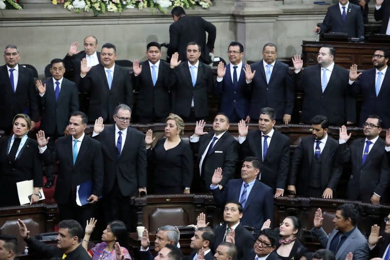 Guatemalan Congress representatives take the oath during inauguration day of President-elect Bernardo Arevalo, in Guatemala City