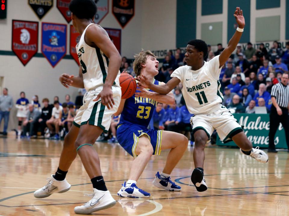 Hayden Jarrett has the ball stripped by Ja'son Barrino during Maysville's 58-50 win against host Malvern on Tuesday, Jan. 3, 2023.