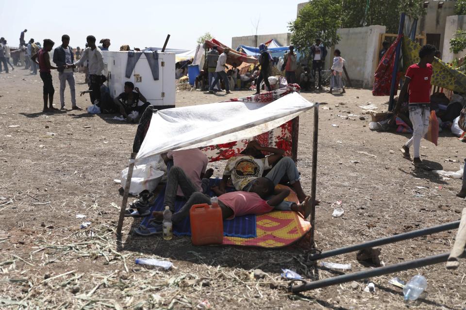 Refugees from the Tigray region of Ethiopia wait to register at the UNCHR center at Hamdayet, Sudan on Saturday, Nov. 14, 2020. Ethiopia’s defiant Tigray regional government has fired rockets at two airports in the neighboring Amhara region as a deadly conflict threatens to spread into other parts of Africa’s second-most populous country. (AP Photo/Marwan Ali)