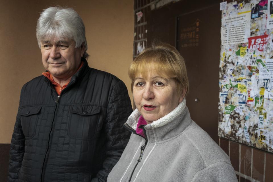 In this photo taken on Monday, April 15, 2019, Olha Zyusko, 60, and Alexander Zyusko, 64, left, supporters of presidential candidate Volodymyr Zelenskiy, speak to The Associated Press in Kryvyi Rih, eastern Ukraine. “We used to be part of the middle class, but now we have come down,” Olha Zyusko said. “We worked all our life only to become beggars.” Zelenskiy, an actor and comedian, is running against incumbent President Petro Poroshenko in a runoff election on Sunday, April 21. (AP Photo/Evgeniy Maloletka)