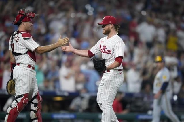 Nola, Schwarber help the Phillies beat the Brewers 4-3 for their 4th  straight victory