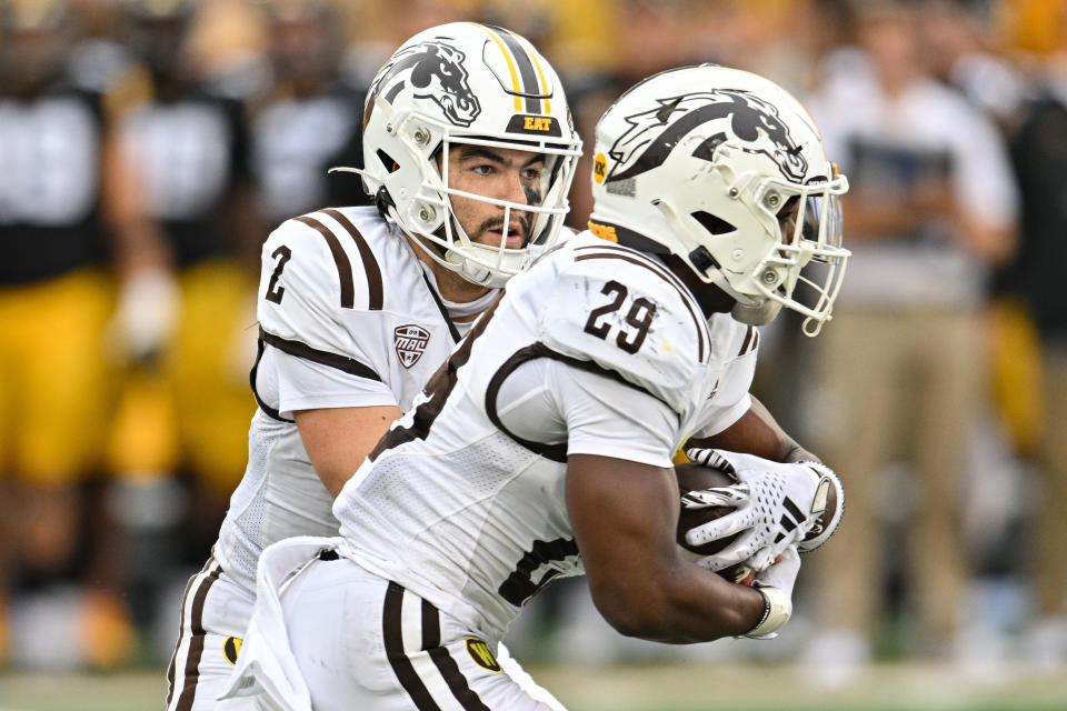 Sep 16, 2023; Iowa City, Iowa, USA; Western Michigan Broncos quarterback Treyson Bourguet (2) and running back Jalen Buckley (29) in action during the game against the Iowa Hawkeyes at Kinnick Stadium. Mandatory Credit: Jeffrey Becker-USA TODAY Sports