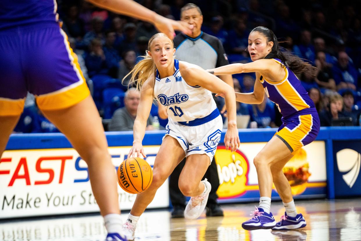 Drake's Katie Dinnebier takes the ball past her UNI defender Sunday, Feb. 25, 2024, at Knapp Center in Des Moines.