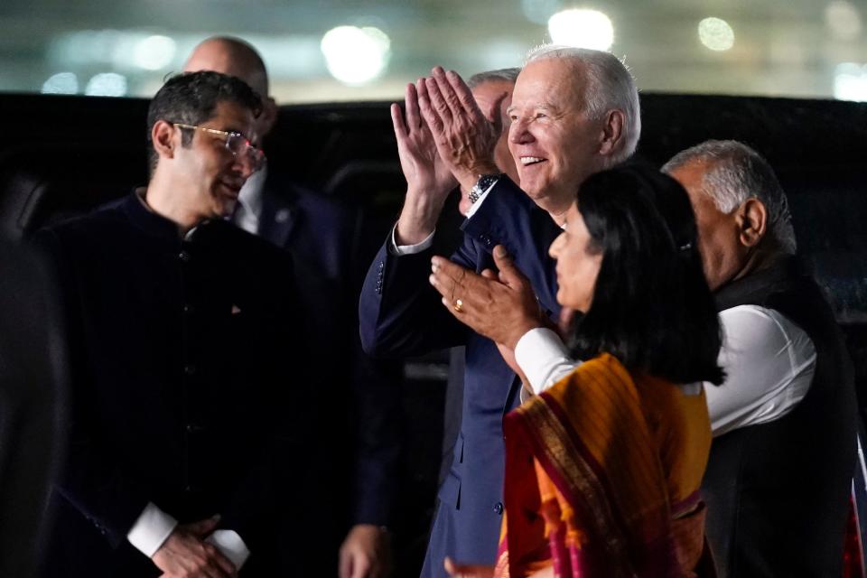 President Joe Biden applauds a group of dancers who greeted him upon his arrival at Indira Gandhi International Airport in New Delhi, India. Biden is attending the G-20 summit of world leaders.