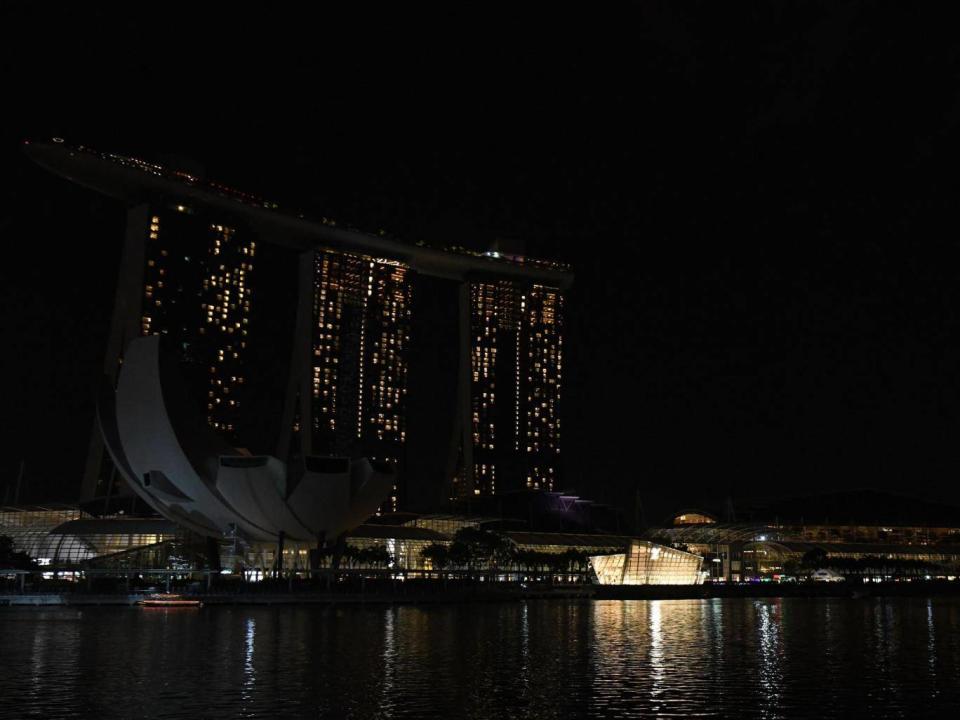 Marina Bay Sands hotel and resort with the lights switched off during the Earth Hour environmental campaign in Singapore (Getty Images)