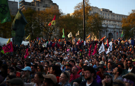 Climate change activists wait for Swedish environmentalist Greta Thunberg to speak during the Extinction Rebellion protest at Marble Arch in London, Britain April 21, 2019. REUTERS/Hannah McKay