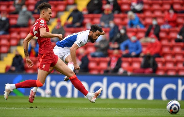 Andros Townsend, right, shoots at goal