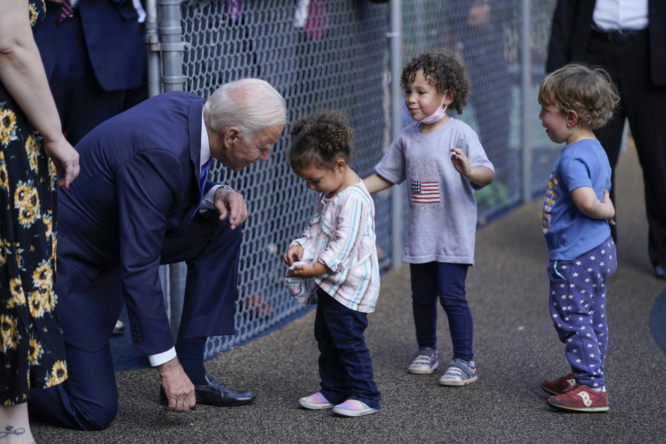 President Joe Biden greets children as he visits the Capitol Child Development Center, Friday, Oct. 15, 2021, in Hartford, Conn. (AP Photo/Evan Vucci)