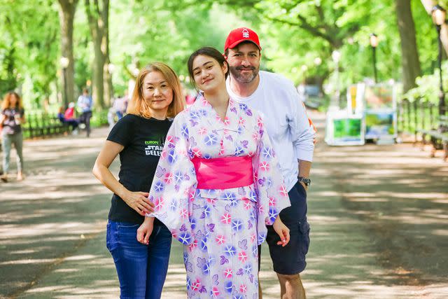 <p>Takako Harkness</p> Naomi Sacks with her parents Masako and Ethan in Central Park in June 2023.