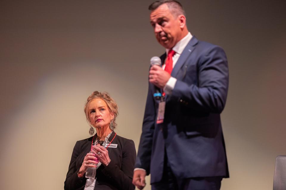 Utah Congressional District 2 representative candidate Kathleen Anderson listens as Greg Hughes speaks during the first Congressional District 2 debate at Woods Cross High School in Woods Cross on June 20, 2023. | Ryan Sun, Deseret News