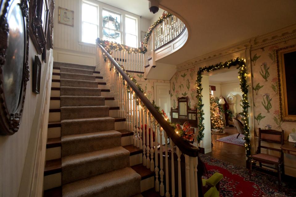 Festooned with lights for the Christmas holidays, the Murray Baker House is one of six historic properties on the Peoria Historical Society Holiday Home Tour Dec. 3 and 4.