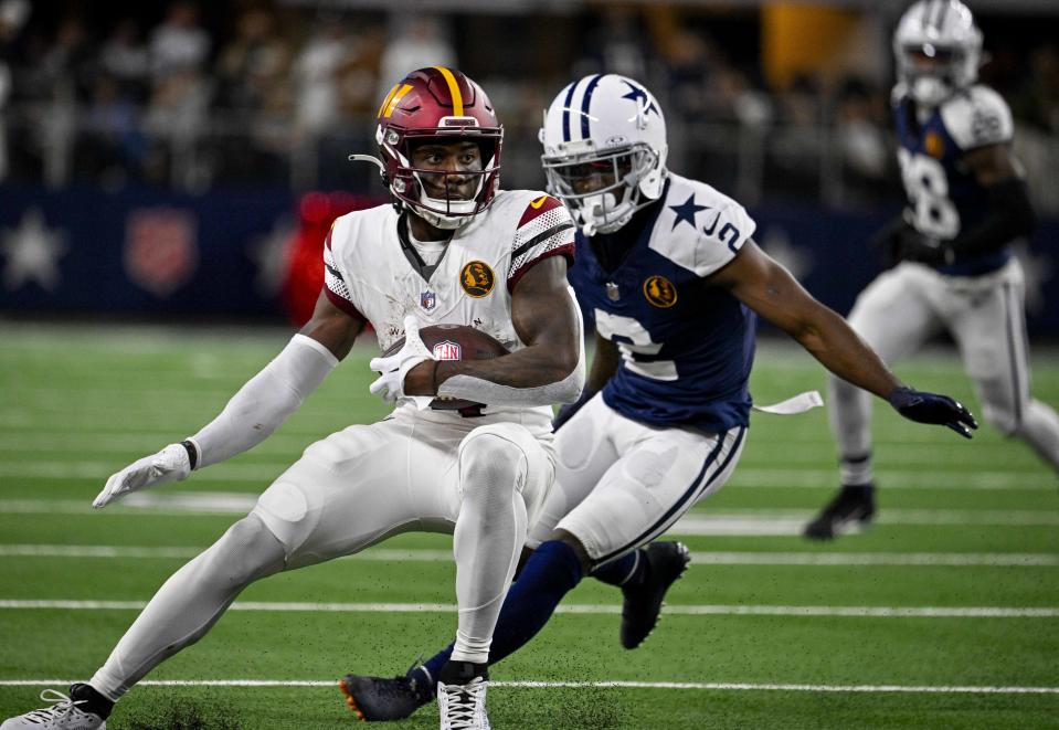 Washington Commanders wide receiver <a class="link " href="https://sports.yahoo.com/nfl/players/30153" data-i13n="sec:content-canvas;subsec:anchor_text;elm:context_link" data-ylk="slk:Curtis Samuel;sec:content-canvas;subsec:anchor_text;elm:context_link;itc:0">Curtis Samuel</a> (4) catches a pass in front of Dallas Cowboys cornerback <a class="link " href="https://sports.yahoo.com/nfl/players/30205" data-i13n="sec:content-canvas;subsec:anchor_text;elm:context_link" data-ylk="slk:Jourdan Lewis;sec:content-canvas;subsec:anchor_text;elm:context_link;itc:0">Jourdan Lewis</a> (2). Mandatory Credit: Jerome Miron-USA TODAY Sports