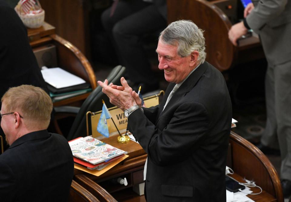 S.D. Senator Dean Wink applauds as Lee Schoenbeck is sworn in as President Pro Tempore on Tuesday, January 10, 2023, at the South Dakota State Capitol in Pierre.