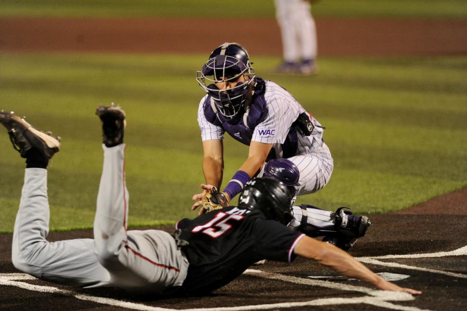 ACU catcher Tanner Tweedt tries to tag out Texas Tech's Parker Kelly.