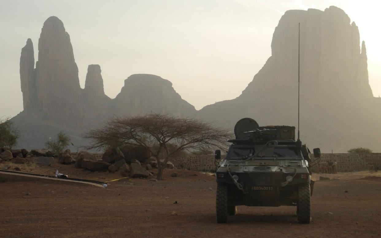 A French armoured vehicle drives by Mount Hombori in Mali in 2019 - DAPHNE BENOIT /AFP
