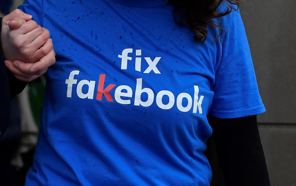 A campaigner from a political pressure group protests as founder and CEO of Facebook Mark Zuckerberg failed to attend a meeting on fake news held by Parliament's Digital, Culture Media and Sport committee in London November 27, 2018.  REUTERS/Toby Melville