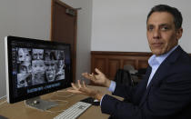 In this Monday, July 1, 2019, photo Hany Farid, a digital forensics expert at the University of California at Berkeley, gestures as he views video clips in his office in Berkeley, Calif. Dumb fakes, shallow fakes and cheap fakes, experts are still undecided on how to label the poorly made manipulated videos being viewed millions of times and even spread by high-ranking politicians. But they are sure that social media users will see much more of these videos ahead of the U.S. 2020 presidential elections. (AP Photo/Ben Margot)