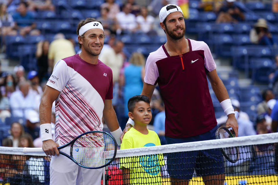 Casper Ruud, of Norway, left, and Karen Khachanov, of Russia, pose of a photo before playing in the semifinals of the U.S. Open tennis championships, Friday, Sept. 9, 2022, in New York. (AP Photo/Matt Rourke)