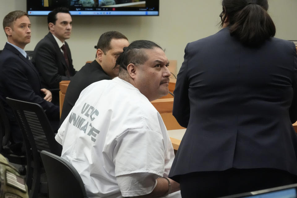 Death row inmate Taberon Honie looks on as he speaks with attorney Therese Day during the Utah Board of Pardons commutation hearing Monday, July 22, 2024, at the Utah State Correctional Facility, in Salt Lake City. (AP Photo/Rick Bowmer, Pool)