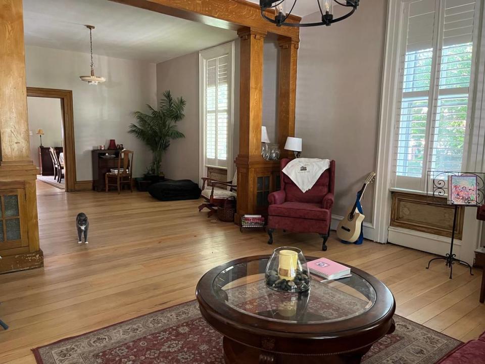 The parlor and sitting area of Barb Swantner’s home at 211 Abend St. in Belleville has 12-foot-high ceilings, interior shutters, original pine floors and fir trim and a resident cat named Sox.
