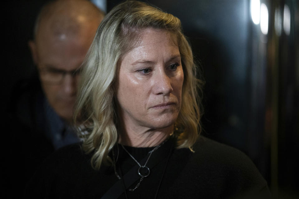 Sarah Stretch, who is married to Joseph David Emerson, a pilot who is accused of trying to turn off the engines in flight of a plane he was riding in while off duty, speaks to reporters after Emerson's indictment hearing on Thursday, Dec. 7, 2023, in Portland, Ore. Emerson pleaded not guilty to reduced charges of reckless endangerment at his arraignment Thursday. (Dave Killen/The Oregonian via AP, Pool)