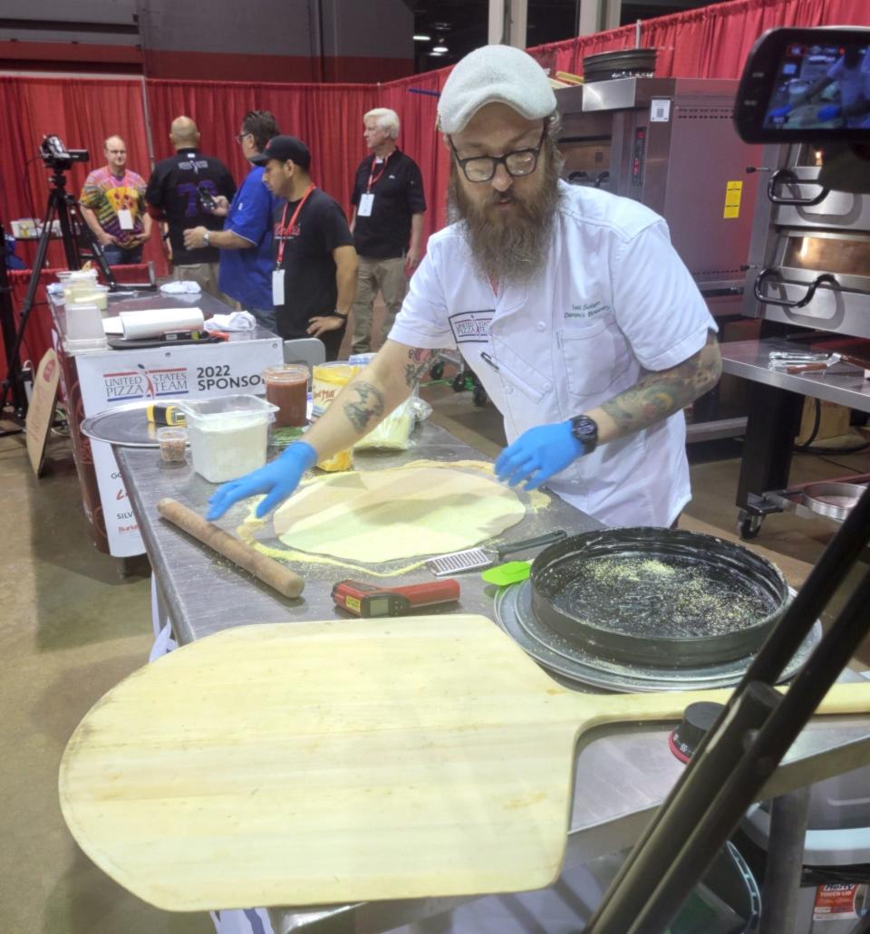 David Solum makes a tavern style pizza at the US Pizza Cup in Chicago on Aug. 24. His award-winning pizza creations will be offered at the new Dempsey's location at the Watertown Regional Airport.