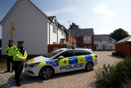 Police officers guard the entrance to a housing estate on Muggleton Road, after it was confirmed that two people had been poisoned with the nerve-agent Novichok, in Amesbury, Britain, July 5, 2018. REUTERS/Henry Nicholls