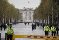 Police forces secure The Mall where Queen Elizabeth II will travel to parliament for the official State Opening of Parliament in London, Monday, Oct. 14, 2019. (AP Photo/Frank Augstein)