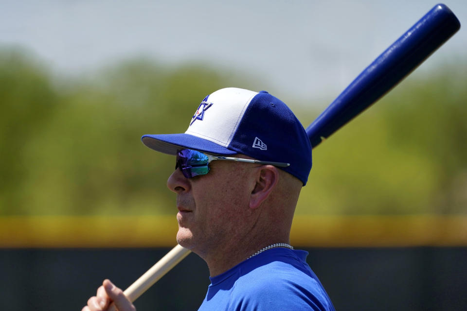 Israel Olympic baseball manager Eric Holtz watches his team practice at Salt River Fields spring training facility, Wednesday, May 12, 2021, in Scottsdale, Ariz. Israel has qualified for the six-team baseball tournament at the Tokyo Olympic games which will be its first appearance at the Olympics in any team sport since 1976. (AP Photo/Matt York)