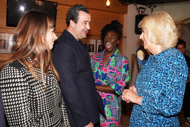 <p>Jordan Pettitt-WPA Pool/Getty</p> Daniel Mays speaks with Queen Camilla at RADA on May 29, 2024.