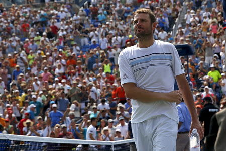 Mardy Fish of the U.S. leaves the court after losing to Feliciano Lopez of Spain in five sets at the U.S. Open Championships tennis tournament in New York, September 2, 2015. REUTERS/Mike Segar